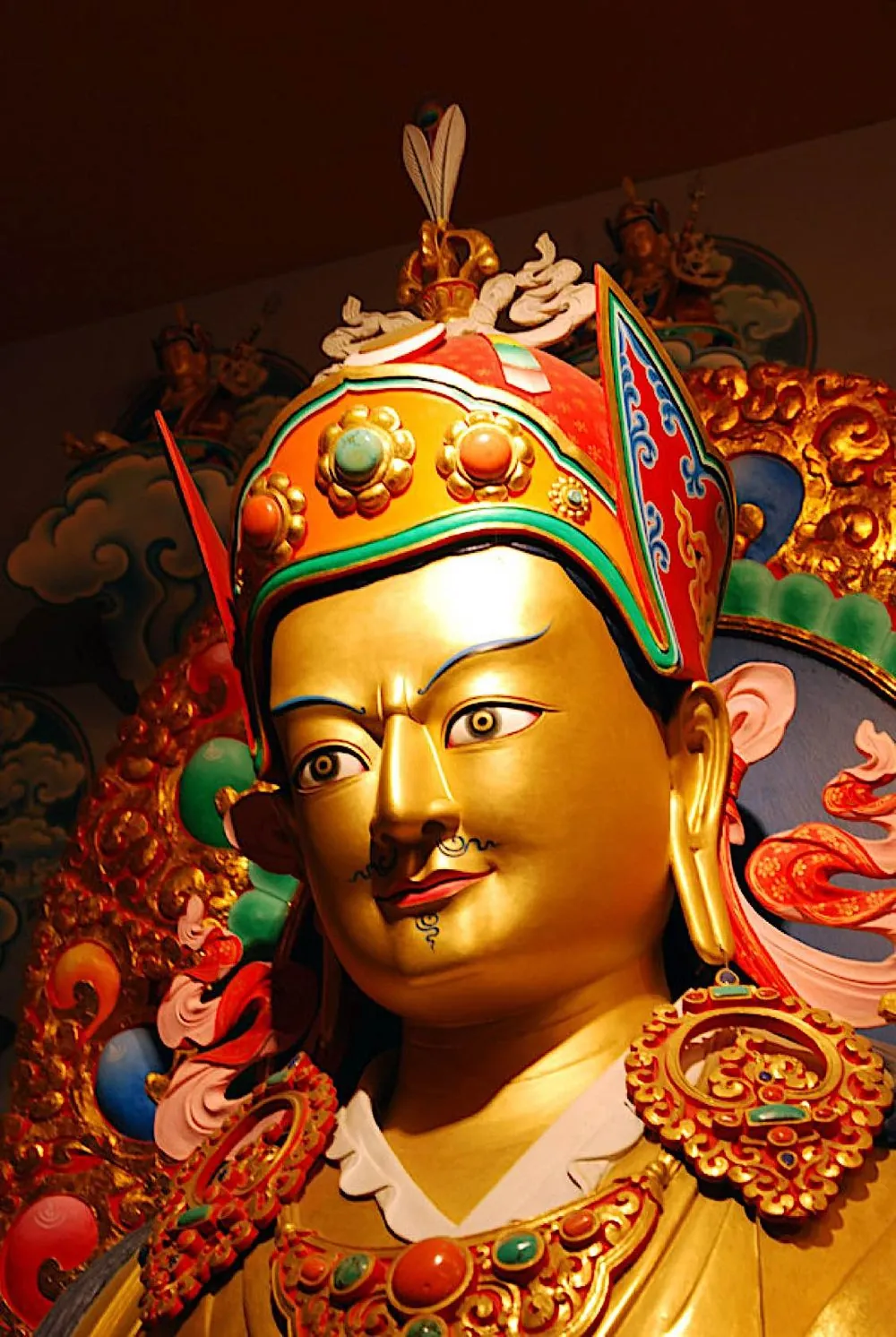 Gilded statue of Guru Rinpoche wearing the lotus crown